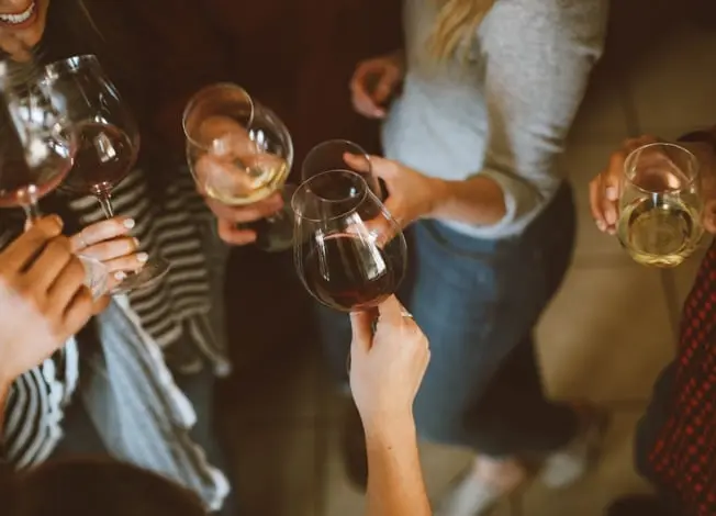 Group of people holding wine glasses
